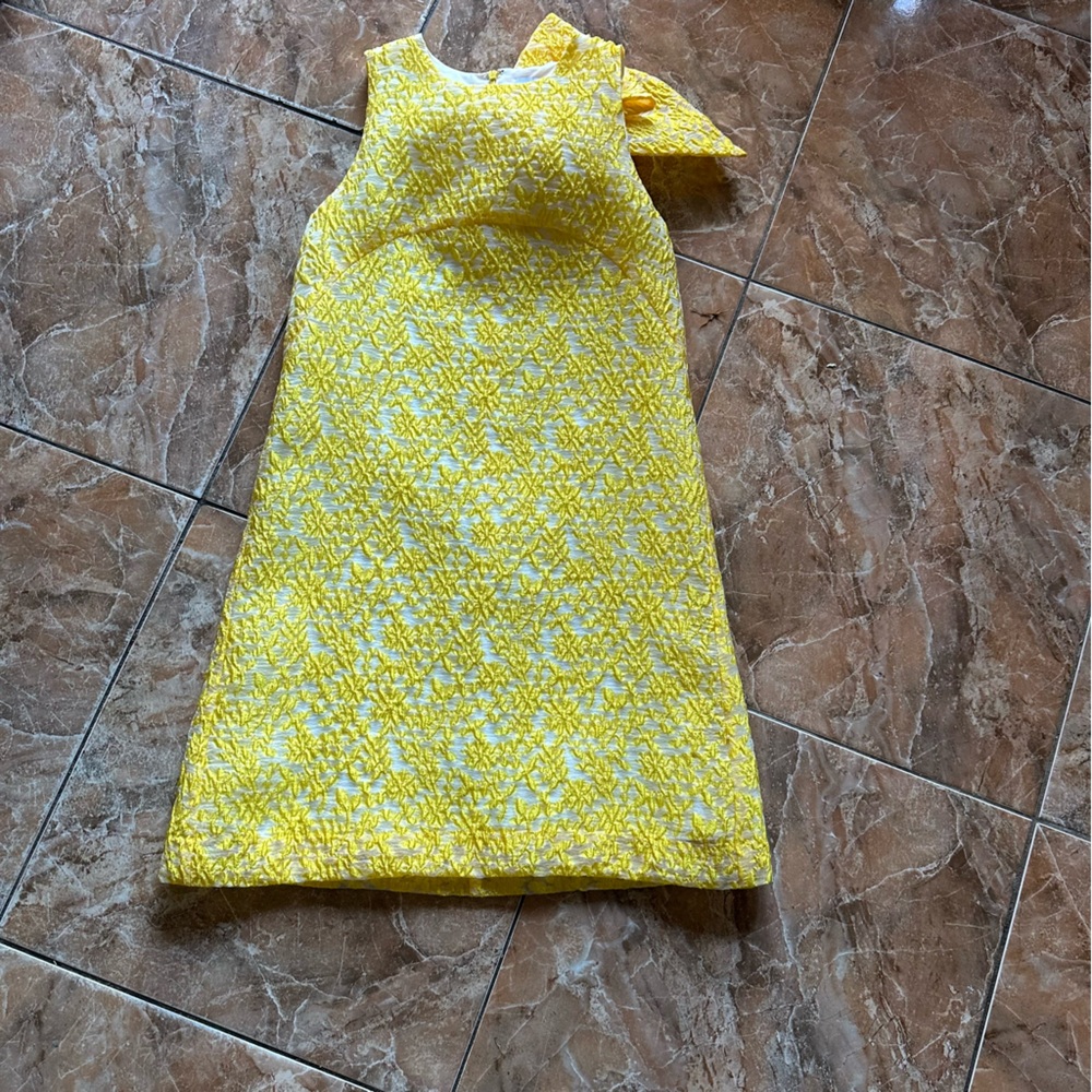Yellow Sleeveless Mini Dress with a bow in the back
